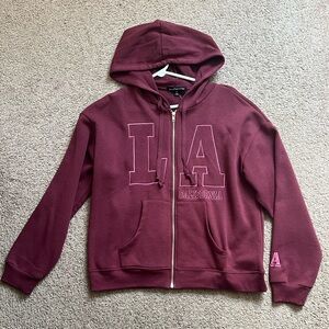 La embroidered zip up